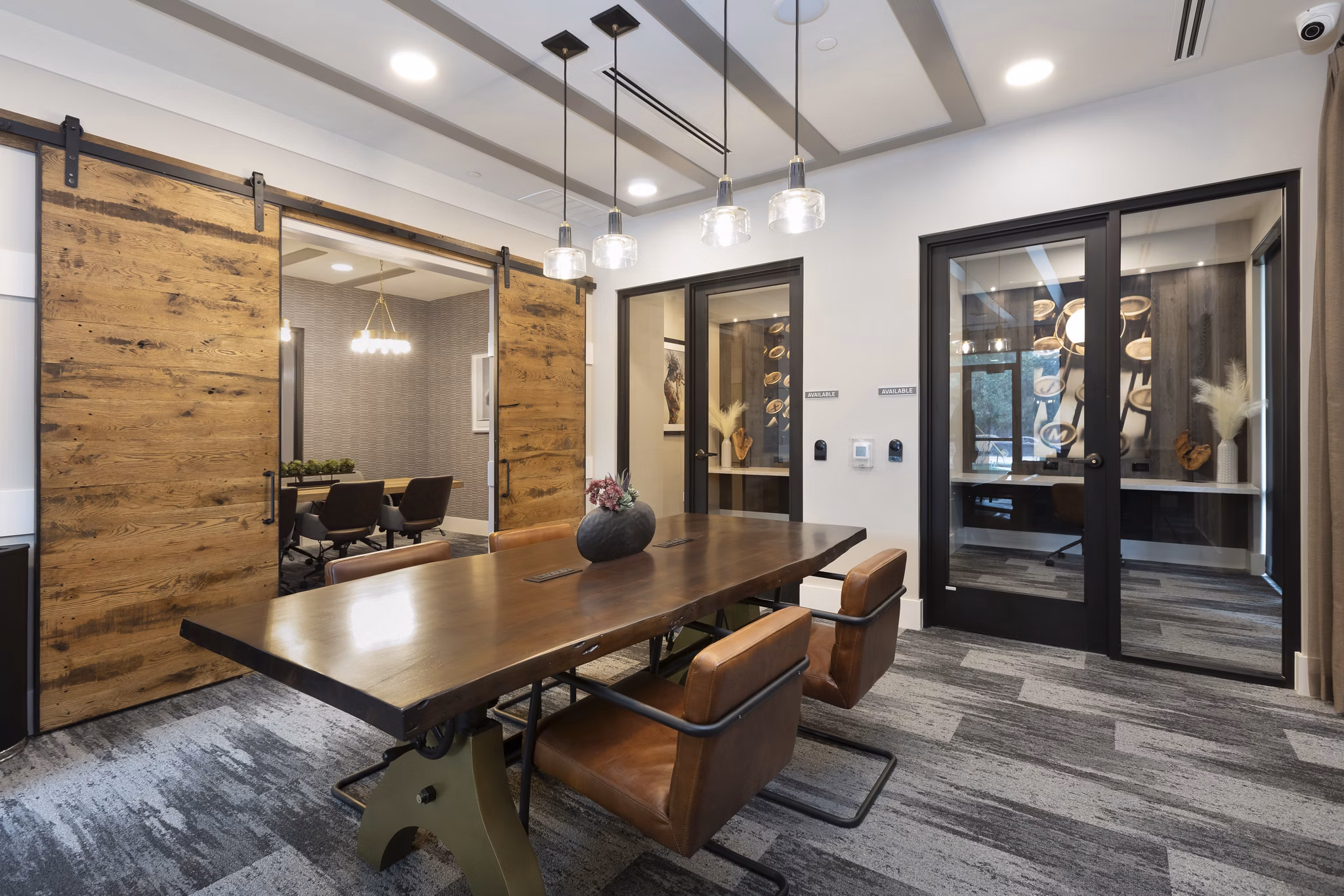 Clubhouse with modern design and comfortable seating at Alta River Oaks Apartments