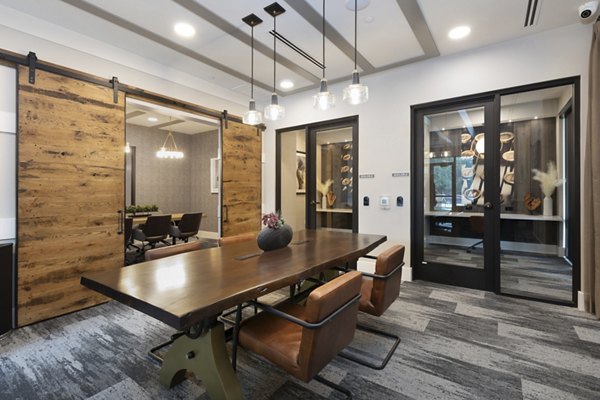 Clubhouse with modern design and comfortable seating at Alta River Oaks Apartments
