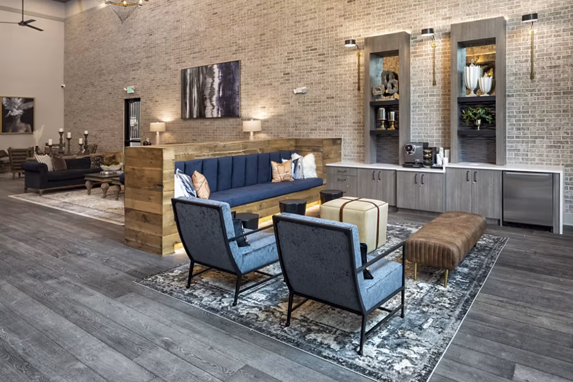 Clubhouse featuring modern design and comfortable seating at Alta River Oaks Apartments