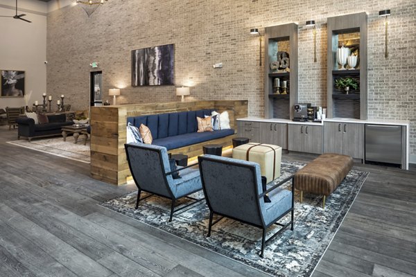 Clubhouse featuring modern design and comfortable seating at Alta River Oaks Apartments