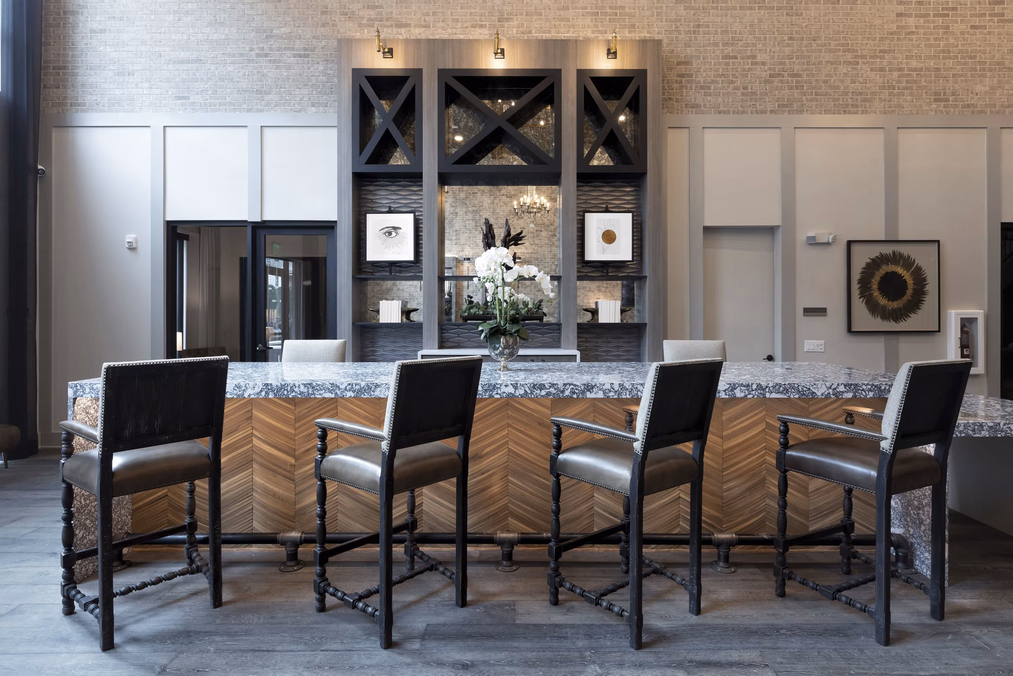 Clubhouse with modern design elements and cozy seating at Alta River Oaks Apartments, offering a luxurious community space for residents