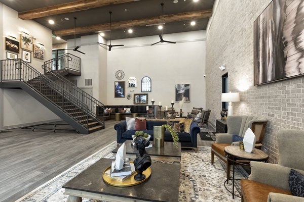 Clubhouse with modern design and ample seating at Alta River Oaks Apartments
