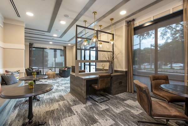 Clubhouse with modern design and comfortable seating at Alta River Oaks Apartments, a luxury community in Houston