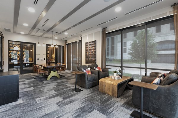 Modern clubhouse with plush seating and pool tables at Alta River Oaks Apartments, offering luxury amenities in a vibrant Houston community