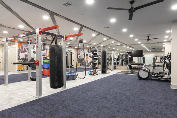 Modern fitness center with state-of-the-art equipment at Alta River Oaks Apartments, enhancing luxury living in the vibrant community