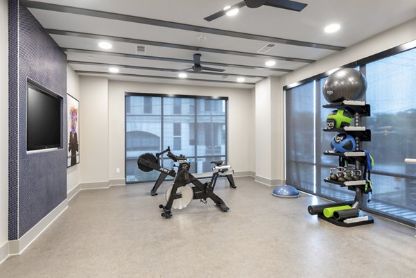 State-of-the-art fitness center with modern equipment at Alta River Oaks Apartments