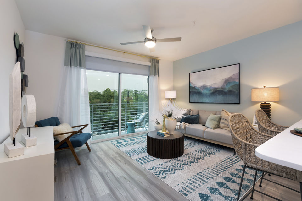Modern living room featuring sleek furniture and stylish decor at Alta River Oaks Apartments