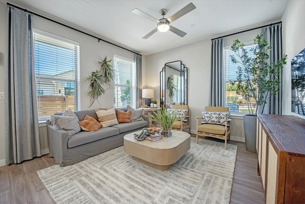 Living room with modern decor and ample natural light at Alta Rolling Oaks luxury apartments