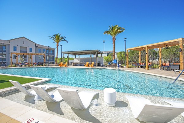 Resort-style outdoor pool at Alta Rolling Oaks luxury apartments