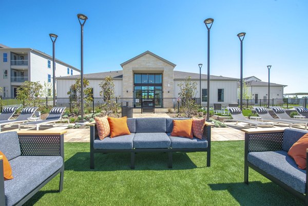 Chic outdoor patio with modern seating at Alta Rolling Oaks luxury apartments, perfect for relaxation and social gatherings