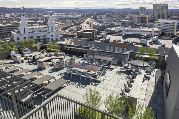 Charming walkable neighborhood at Alta on the Row Apartments, featuring tree-lined streets and local shops