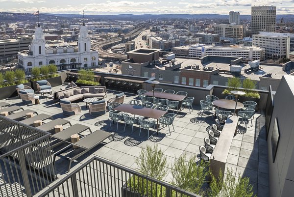 Charming walkable neighborhood at Alta on the Row Apartments, featuring tree-lined streets and local shops