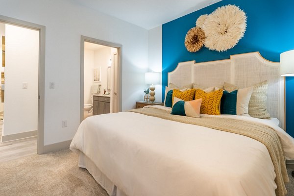 Cozy bedroom with contemporary furnishings at Alta Sergeant Apartments
