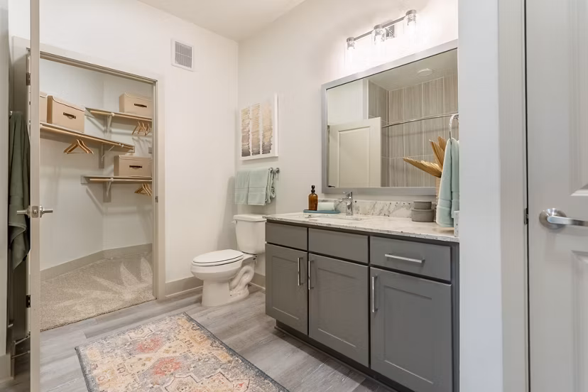 Boutique bathroom design with elegant fixtures in Alta Sergeant Apartments luxury community