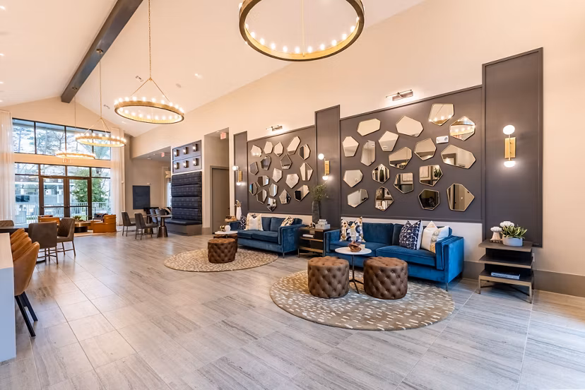 Clubhouse featuring modern decor and plush seating at Alta Sergeant Apartments, a Greystar luxury community