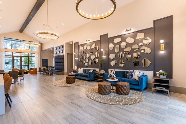Clubhouse featuring modern decor and plush seating at Alta Sergeant Apartments, a Greystar luxury community
