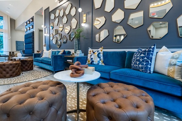 Clubhouse with chic modern design at Alta Sergeant Apartments, offering a luxurious setting for residents' social gatherings