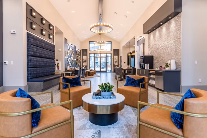 Modern clubhouse with stylish seating and entertainment area at Alta Sergeant Apartments