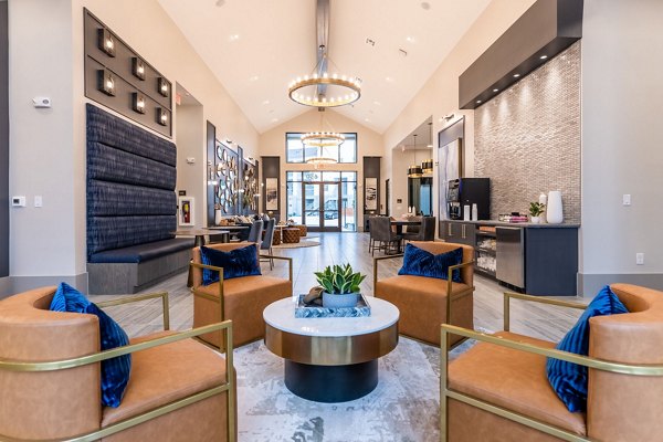 Modern clubhouse with stylish seating and entertainment area at Alta Sergeant Apartments
