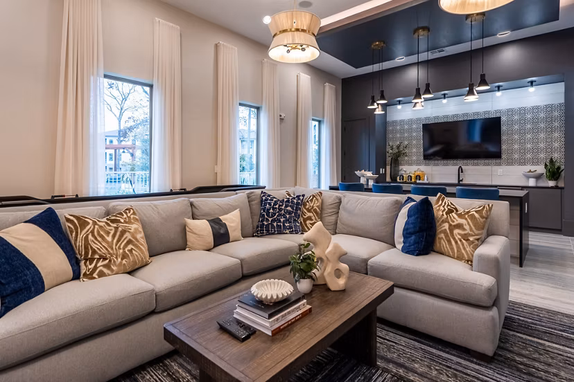 Chic clubhouse with modern seating and fireplace in Alta Sergeant Apartments