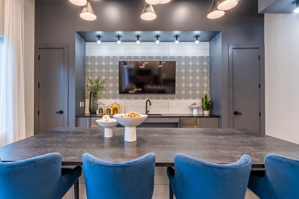 Clubhouse featuring modern design and entertainment spaces at Alta Sergeant Apartments