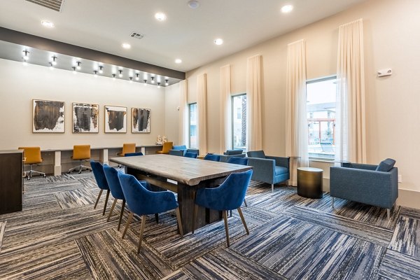 Clubhouse featuring modern design and recreational facilities at Alta Sergeant Apartments