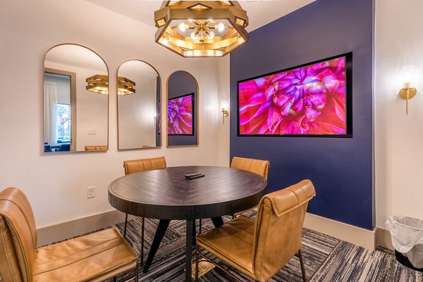 Modern clubhouse featuring elegant design at Alta Sergeant Apartments, offering luxury amenities for residents