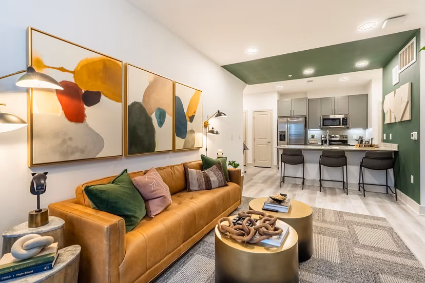 Spacious living room with modern decor in Alta Sergeant Apartments, luxury living by Greystar