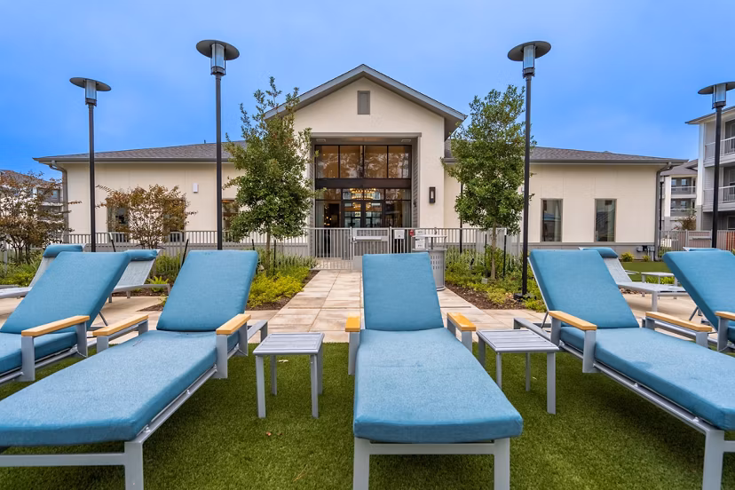 Modern outdoor patio with stylish furniture at Alta Sergeant Apartments, perfect for relaxation and social gatherings