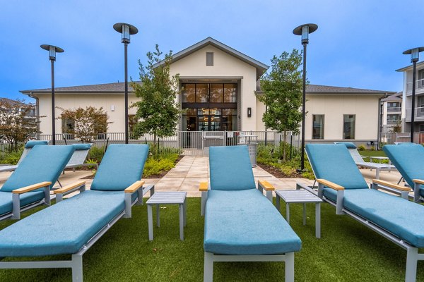 Modern outdoor patio with stylish furniture at Alta Sergeant Apartments, perfect for relaxation and social gatherings