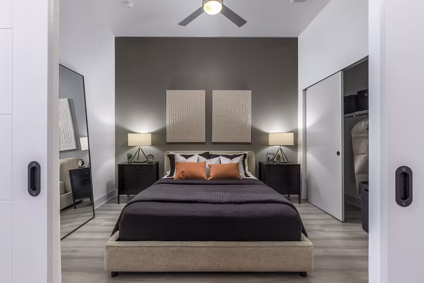 Cozy bedroom with modern furnishings at Alta Sloan's Lake luxury apartments