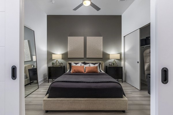 Cozy bedroom with modern furnishings at Alta Sloan's Lake luxury apartments