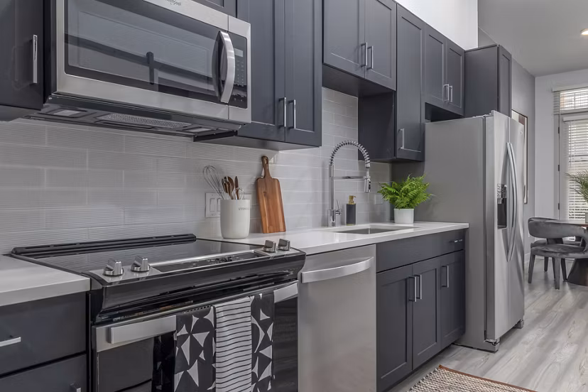 Modern kitchen featuring sleek cabinetry and stainless steel appliances in Alta Sloan's Lake luxury apartments