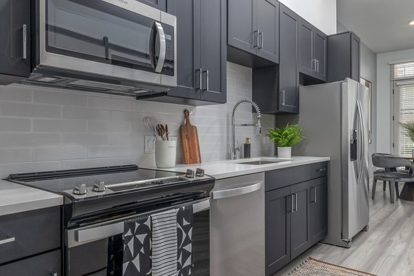 Modern kitchen featuring sleek cabinetry and stainless steel appliances in Alta Sloan's Lake luxury apartments