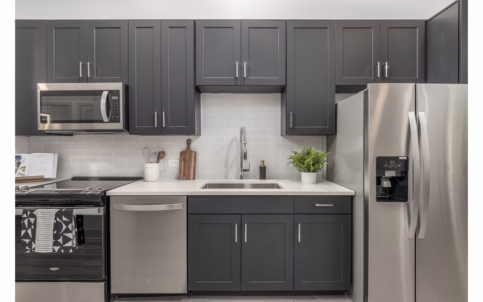 Modern kitchen with stainless steel appliances at Alta Sloan's Lake luxury apartments