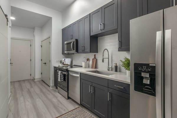 Modern kitchen with stainless steel appliances at Alta Sloan's Lake luxury apartments