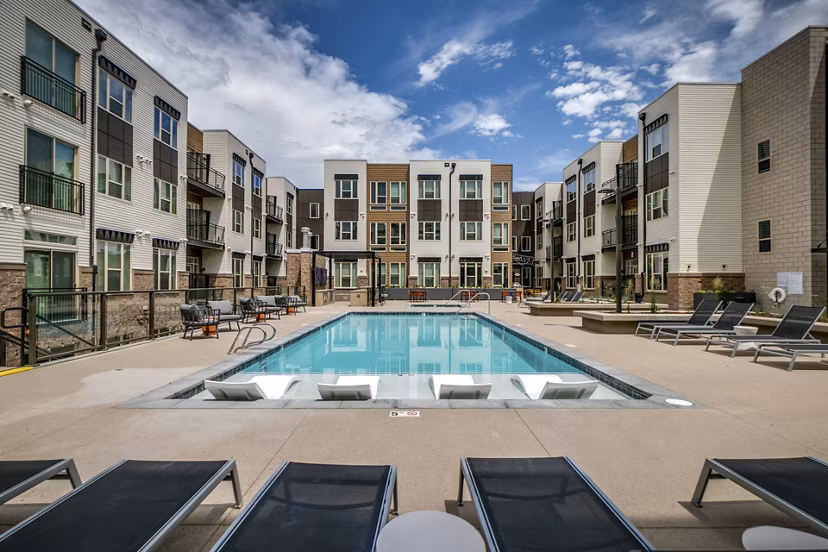 Relaxing poolside at Alta Sloan's Lake luxury apartments, perfect for unwinding and enjoying upscale amenities