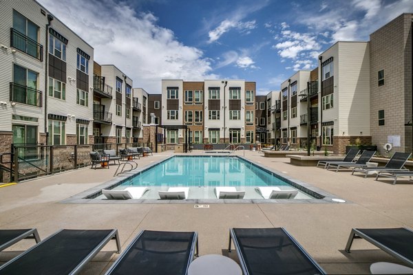 Relaxing poolside at Alta Sloan's Lake luxury apartments, perfect for unwinding and enjoying upscale amenities