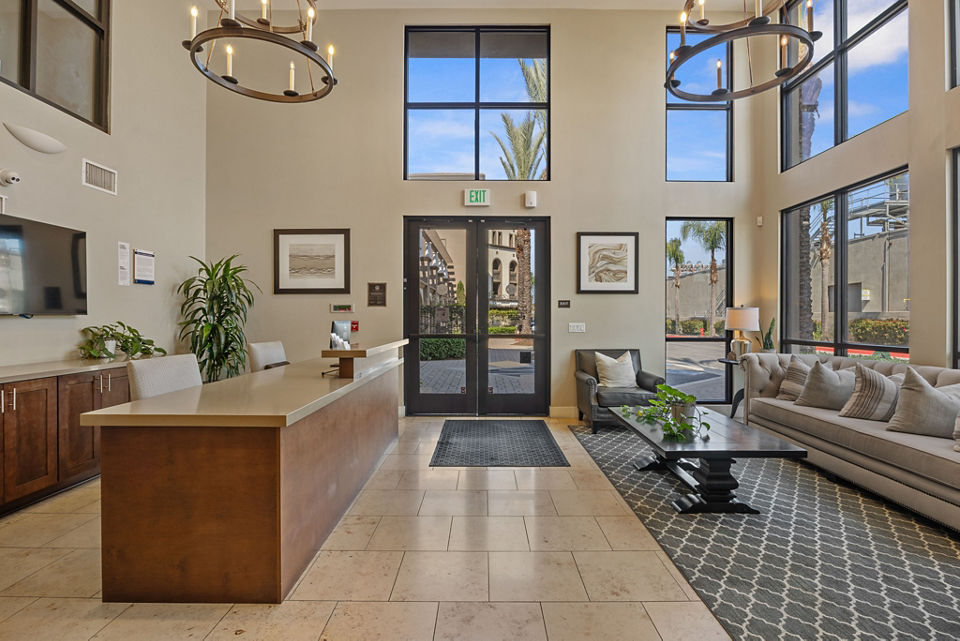 Clubhouse with modern design and comfortable seating at Alta South Bay Apartments