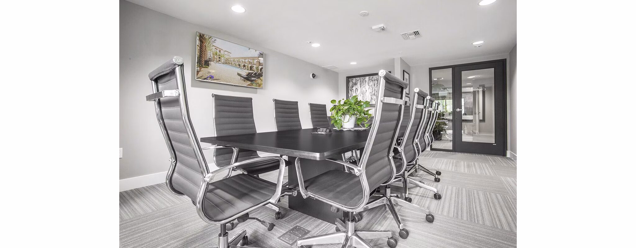 Clubhouse meeting facility with modern seating at Alta South Bay Apartments in a luxury setting for gatherings and events