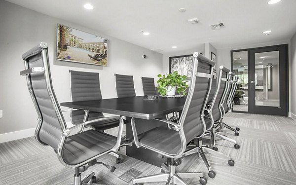 Clubhouse meeting facility with modern seating at Alta South Bay Apartments in a luxury setting for gatherings and events
