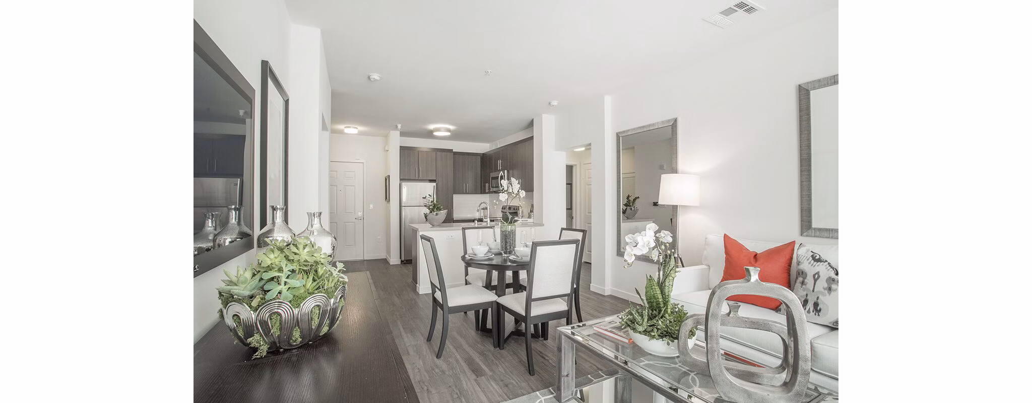 Chic dining and living room with modern decor at Alta South Bay Apartments, ideal for luxurious living in a vibrant community