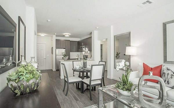 Chic dining and living room with modern decor at Alta South Bay Apartments, ideal for luxurious living in a vibrant community