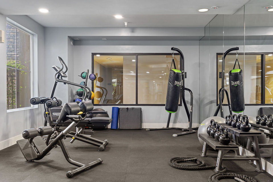 Modern fitness center at Alta South Bay Apartments with state-of-the-art equipment, ideal for luxury living and active lifestyles