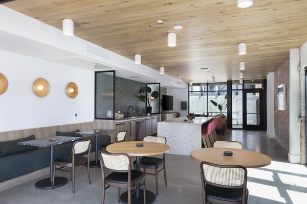 Clubhouse featuring modern design and cozy seating at Alta Star Harbor Apartments