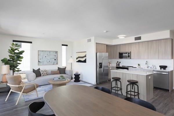 Spacious living room with modern furnishings at Alta Star Harbor Apartments, luxury residence designed by Greystar