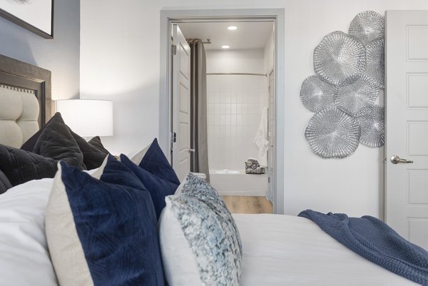 Alta Surprise Apartments: Elegant bedroom featuring chic decor and natural lighting