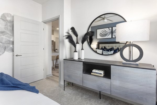 Alta Surprise Apartments: Elegant bedroom design with modern decor and plush bedding in a luxury apartment