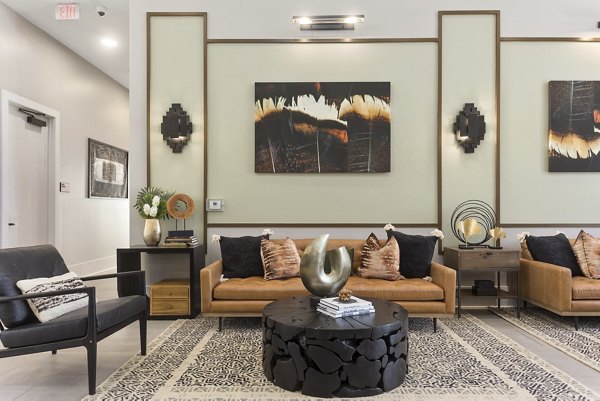 Elegant clubhouse featuring modern design at Alta Surprise Apartments, perfect for social gatherings and relaxation in a luxury setting