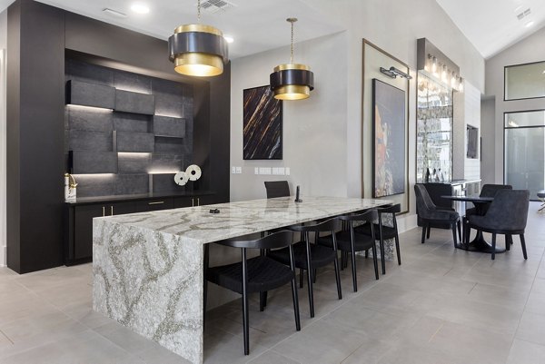Clubhouse featuring modern design and seating areas at Alta Surprise Apartments in Surprise, Arizona